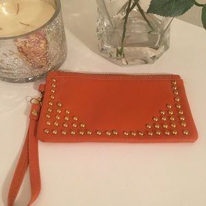 BRAND NEW Orange with gold studs, wristlet